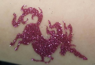 Pink unicorn glitter tattoo